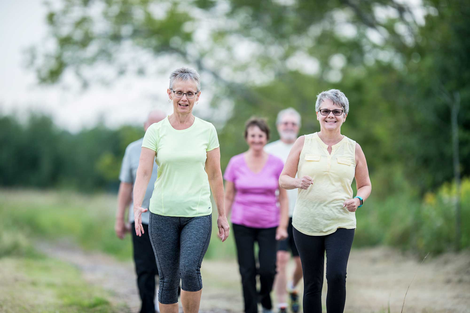 group of seniors taking a walk outside